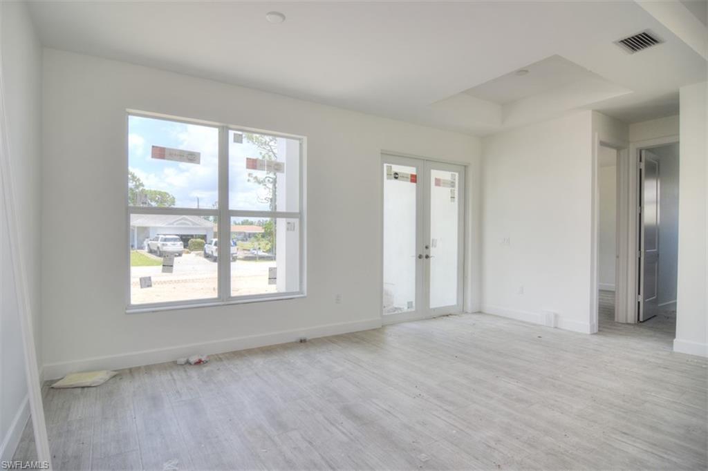 18412 Fuchsia Road Fort Myers, FL 33967 - Photo 4 of 23 an empty room with a window
