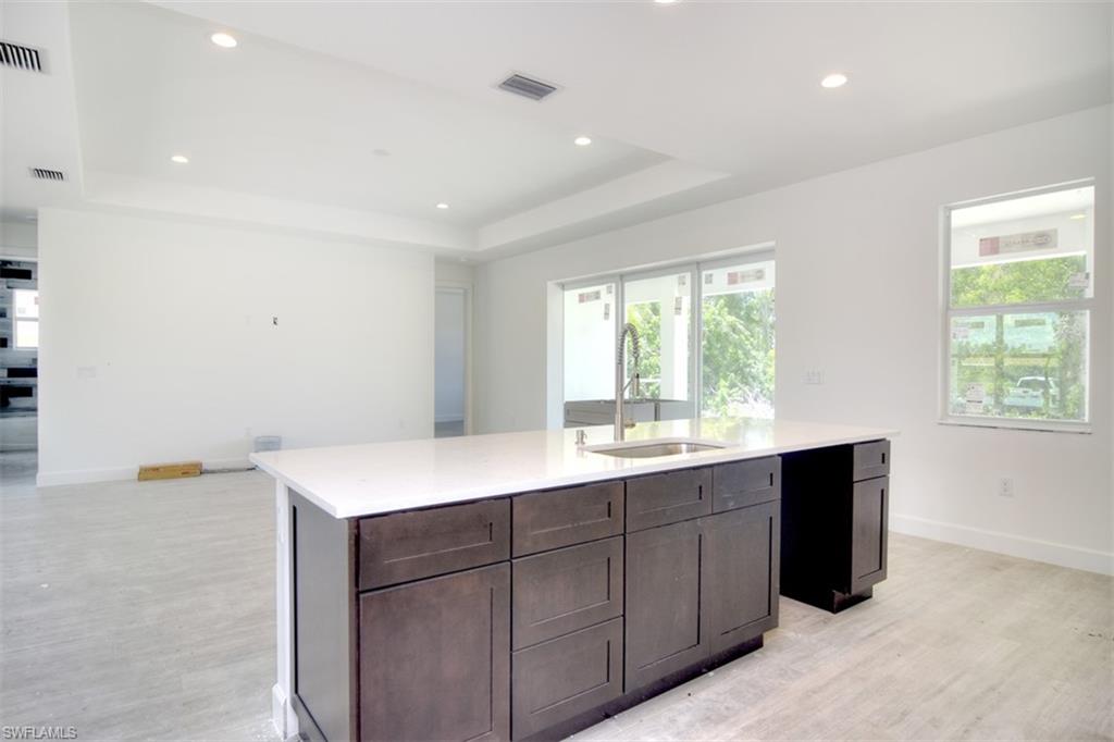 18412 Fuchsia Road Fort Myers, FL 33967 - Photo 7 of 23 a kitchen with a sink and window