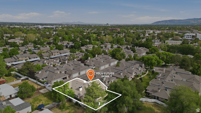 6969 South 855 East Midvale, UT 84047 - Photo 42 of 55 Aerial perspective showcasing a residential property with a light-colored roof and mature trees