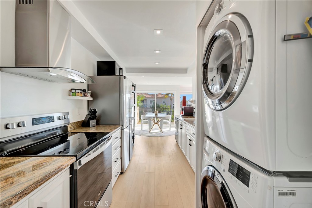 605 Redondo Avenue, Unit 308 Long Beach, CA 90814 - Photo 11 of 38 a kitchen with a sink and a stove top oven