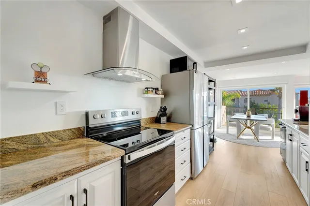 a kitchen with a sink and a stove top oven