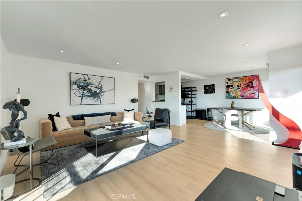 605 Redondo Avenue, Unit 308 Long Beach, CA 90814 - Photo 17 of 38 a living room with furniture and wooden floor
