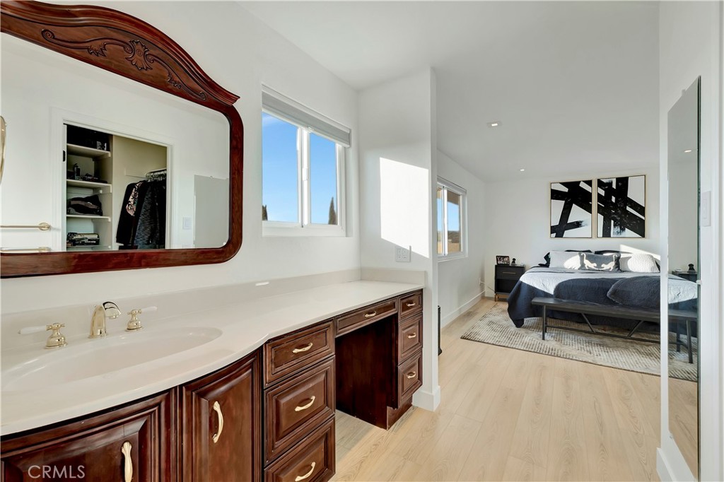 605 Redondo Avenue, Unit 308 Long Beach, CA 90814 - Photo 23 of 38 a en suite spacious bathroom with a sink and a mirror