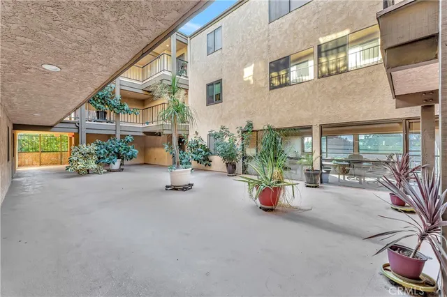 a balcony with table and chairs