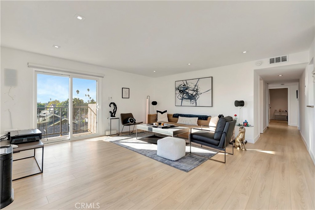 605 Redondo Avenue, Unit 308 Long Beach, CA 90814 - Photo 5 of 38 a living room with furniture and a large window