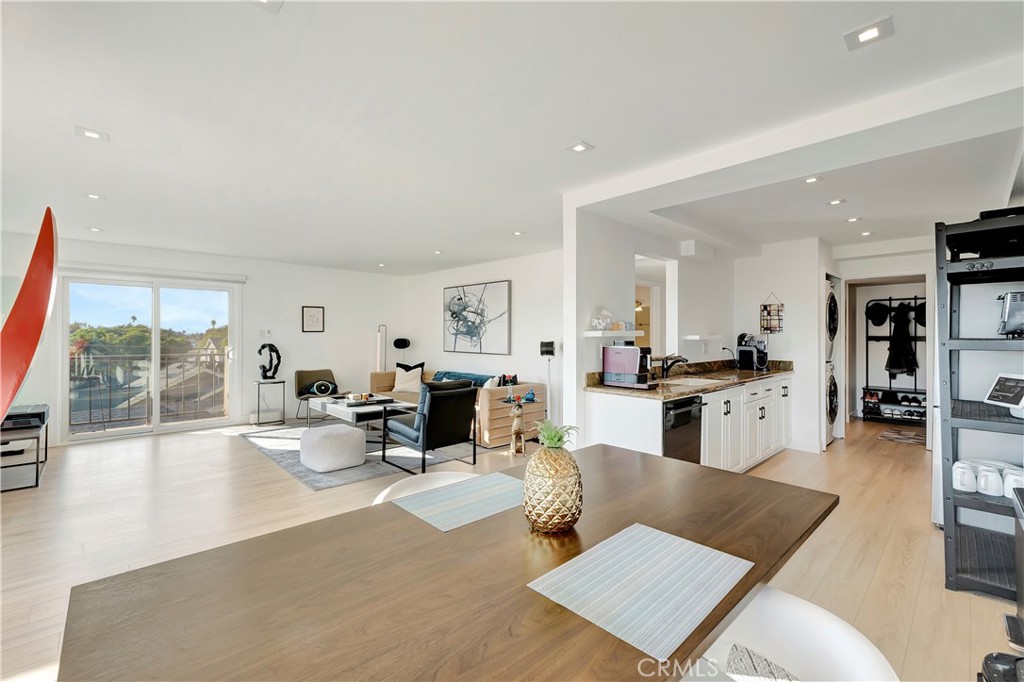 605 Redondo Avenue, Unit 308 Long Beach, CA 90814 - Photo 6 of 38 a living room with furniture kitchen view and a large window