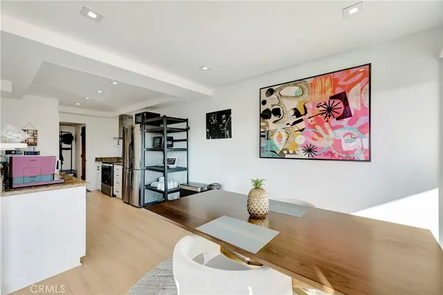 a living room with furniture a flat screen tv and a floor to ceiling window