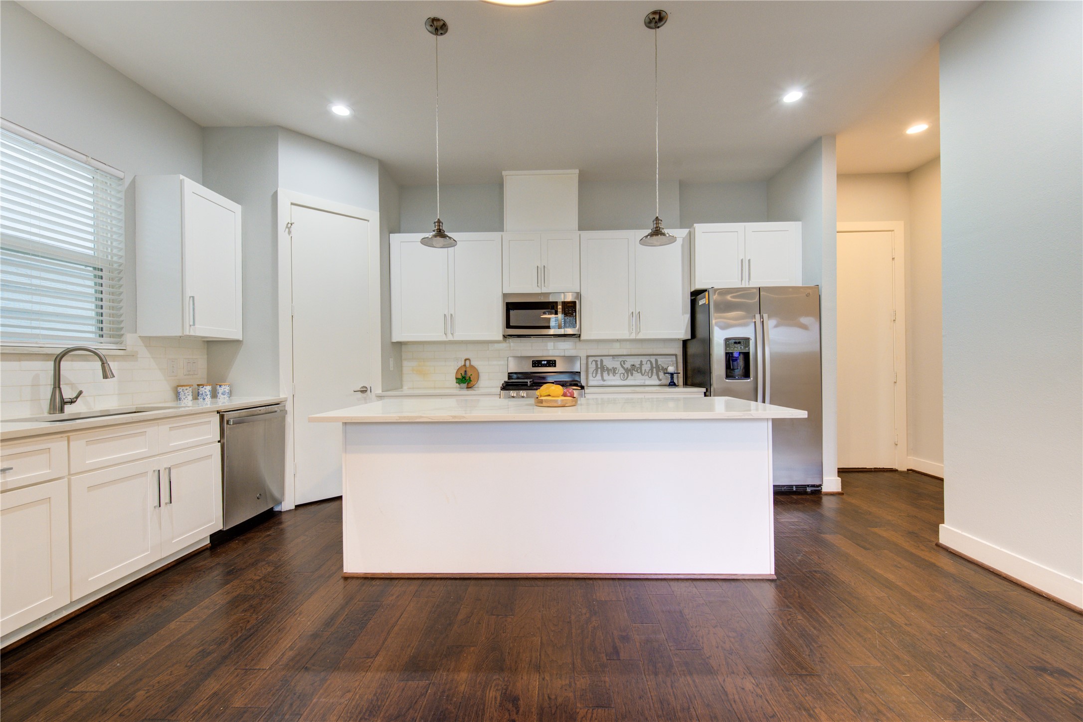 847 Rachel Street, Unit G Houston, TX 77091 - Photo 3 of 42 Thoughtfully designed with direct garage access to the kitchen for everyday convenience and functionality.