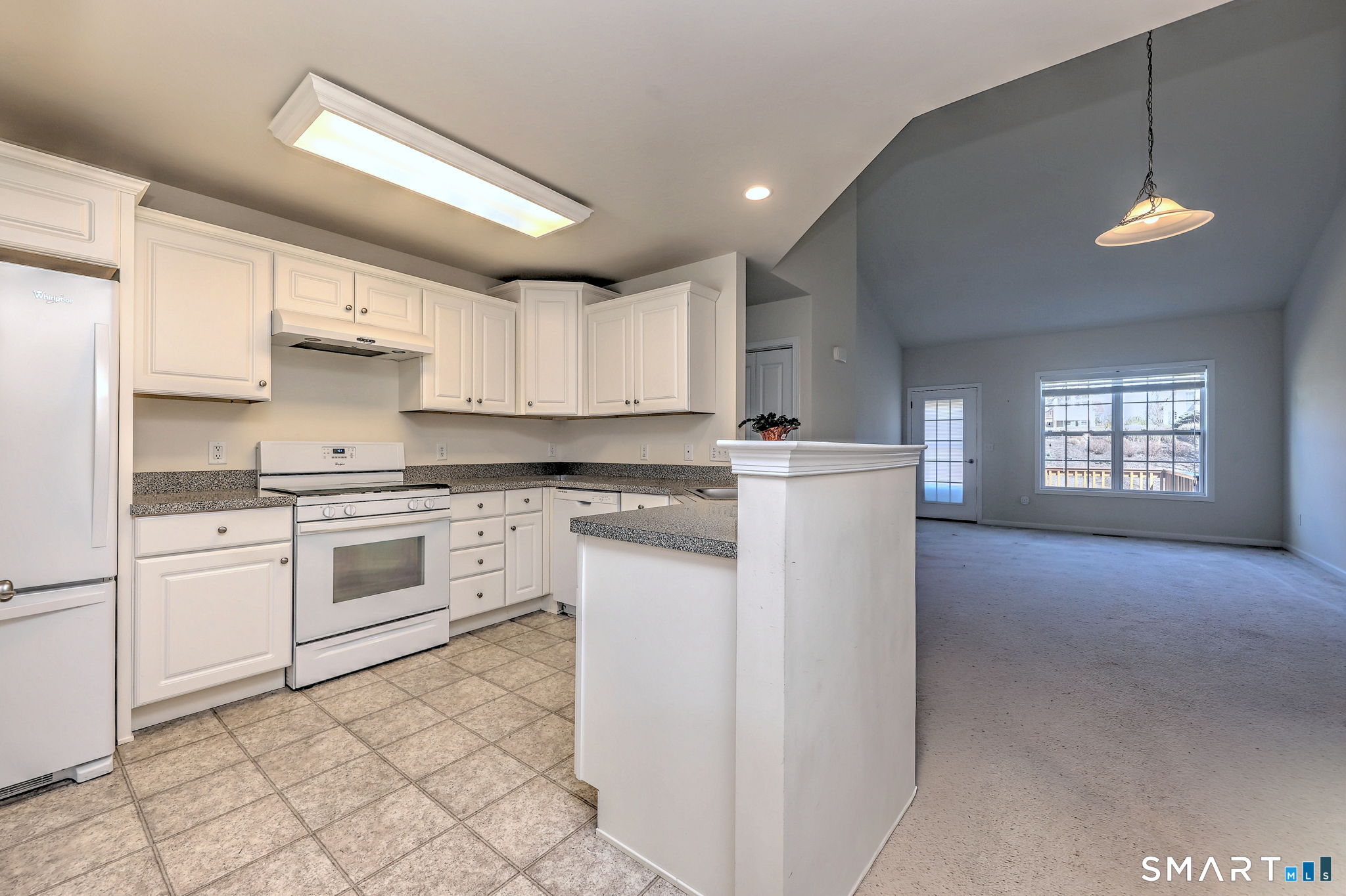 104 Cherry Circle, Unit 104 Prospect, CT 06712 - Photo 11 of 37 a kitchen with granite countertop white cabinets and white appliances
