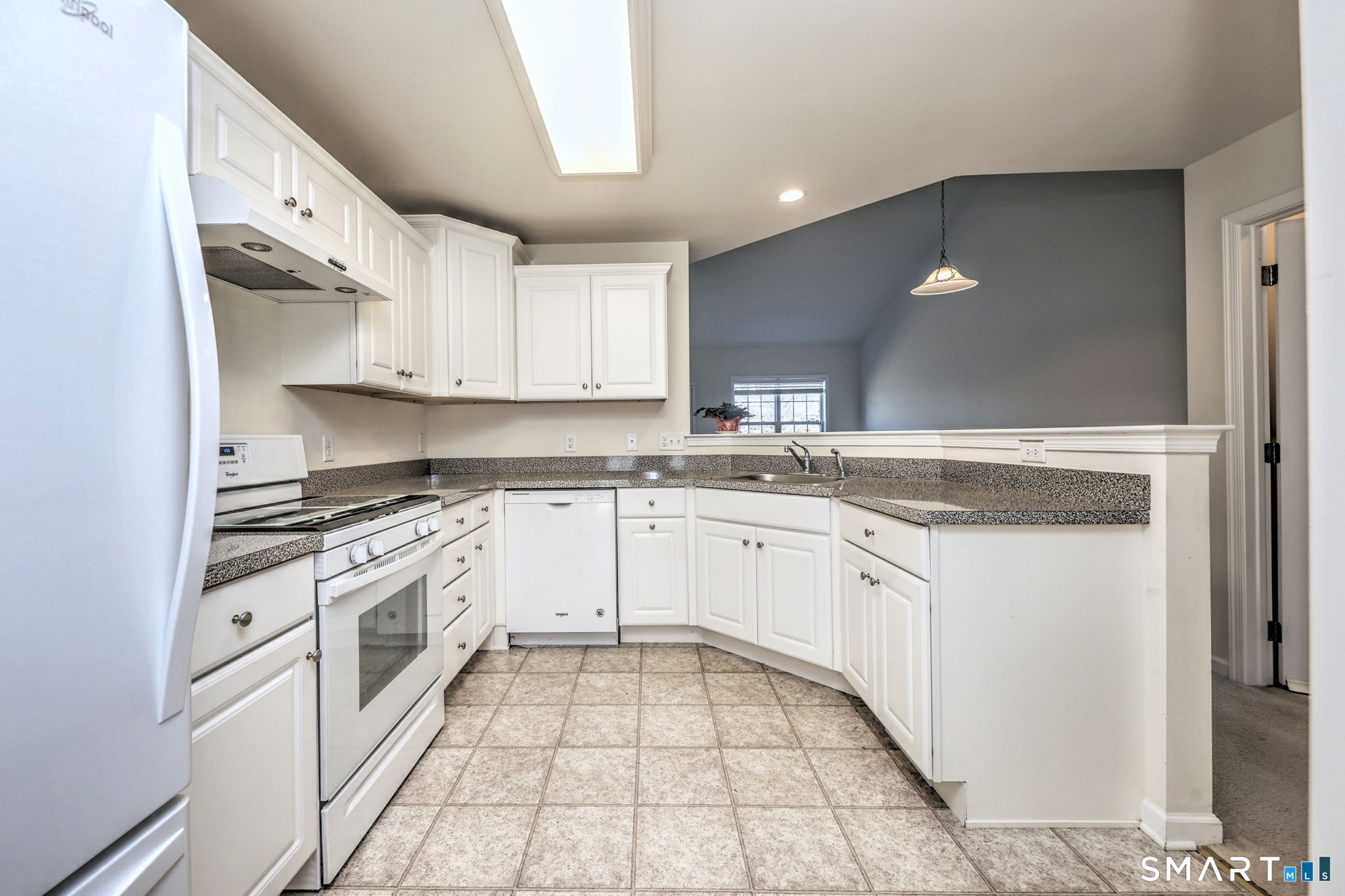 104 Cherry Circle, Unit 104 Prospect, CT 06712 - Photo 13 of 37 a kitchen with granite countertop white cabinets and white appliances