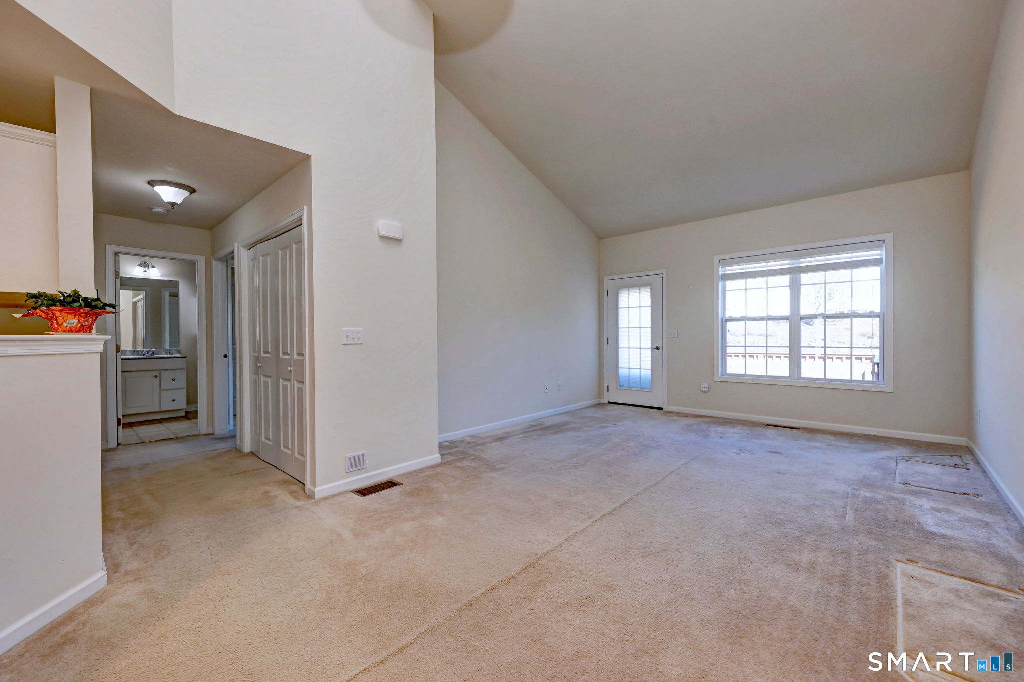 104 Cherry Circle, Unit 104 Prospect, CT 06712 - Photo 14 of 37 an empty room with closet and windows