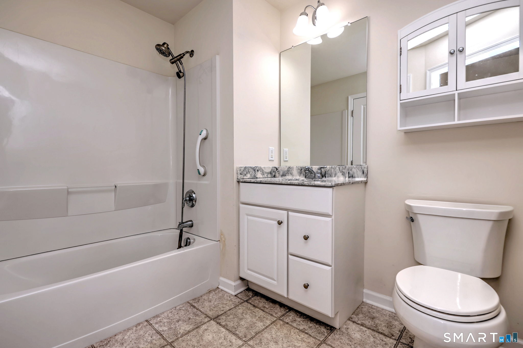 104 Cherry Circle, Unit 104 Prospect, CT 06712 - Photo 19 of 37 a bathroom with a granite countertop toilet a sink and bathtub