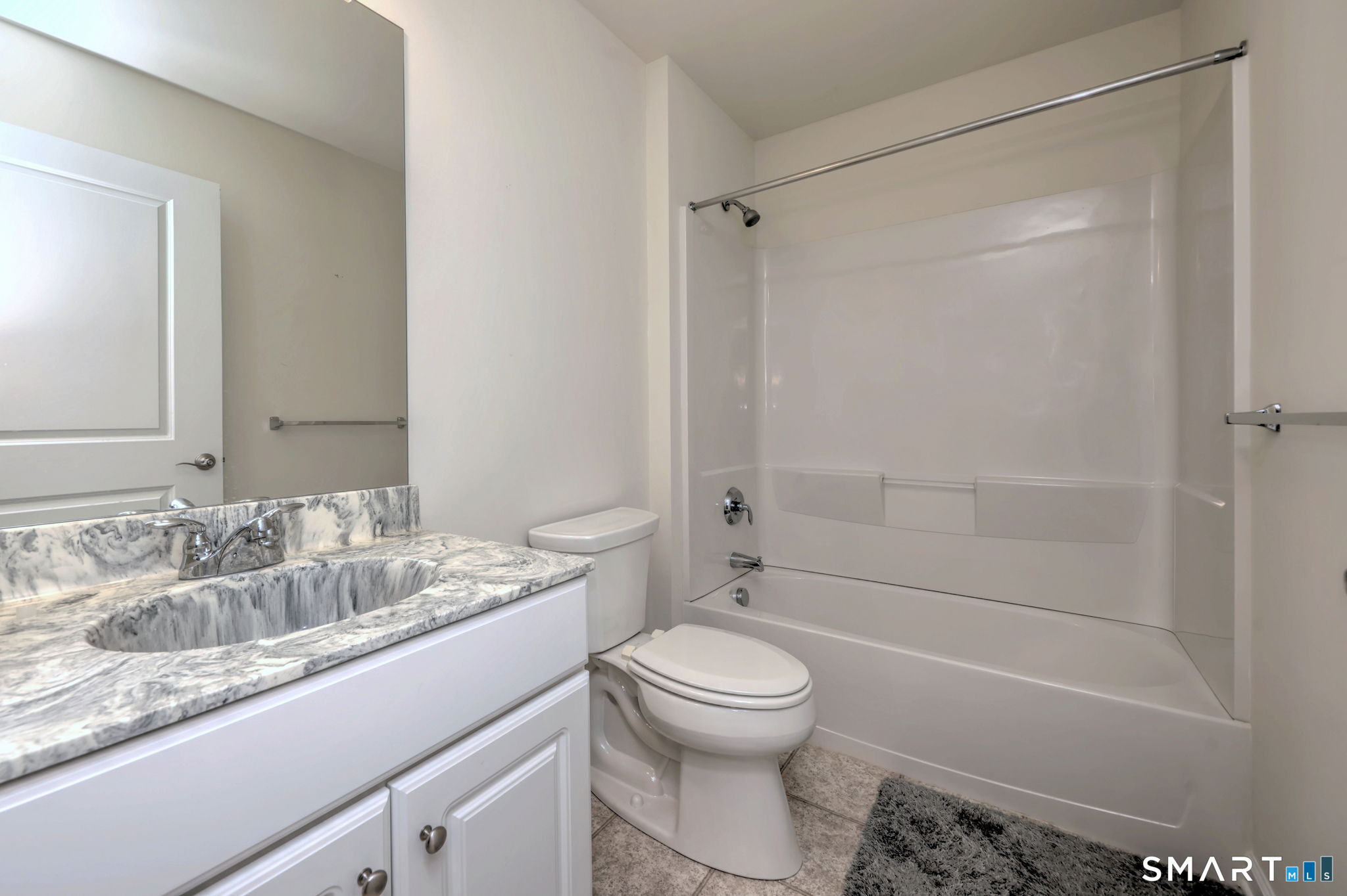 104 Cherry Circle, Unit 104 Prospect, CT 06712 - Photo 29 of 37 a bathroom with a granite countertop sink toilet and shower