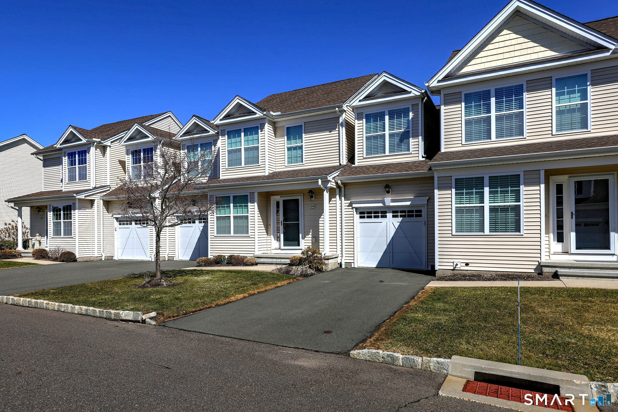 104 Cherry Circle, Unit 104 Prospect, CT 06712 - Photo 3 of 37 front view of a house with a yard