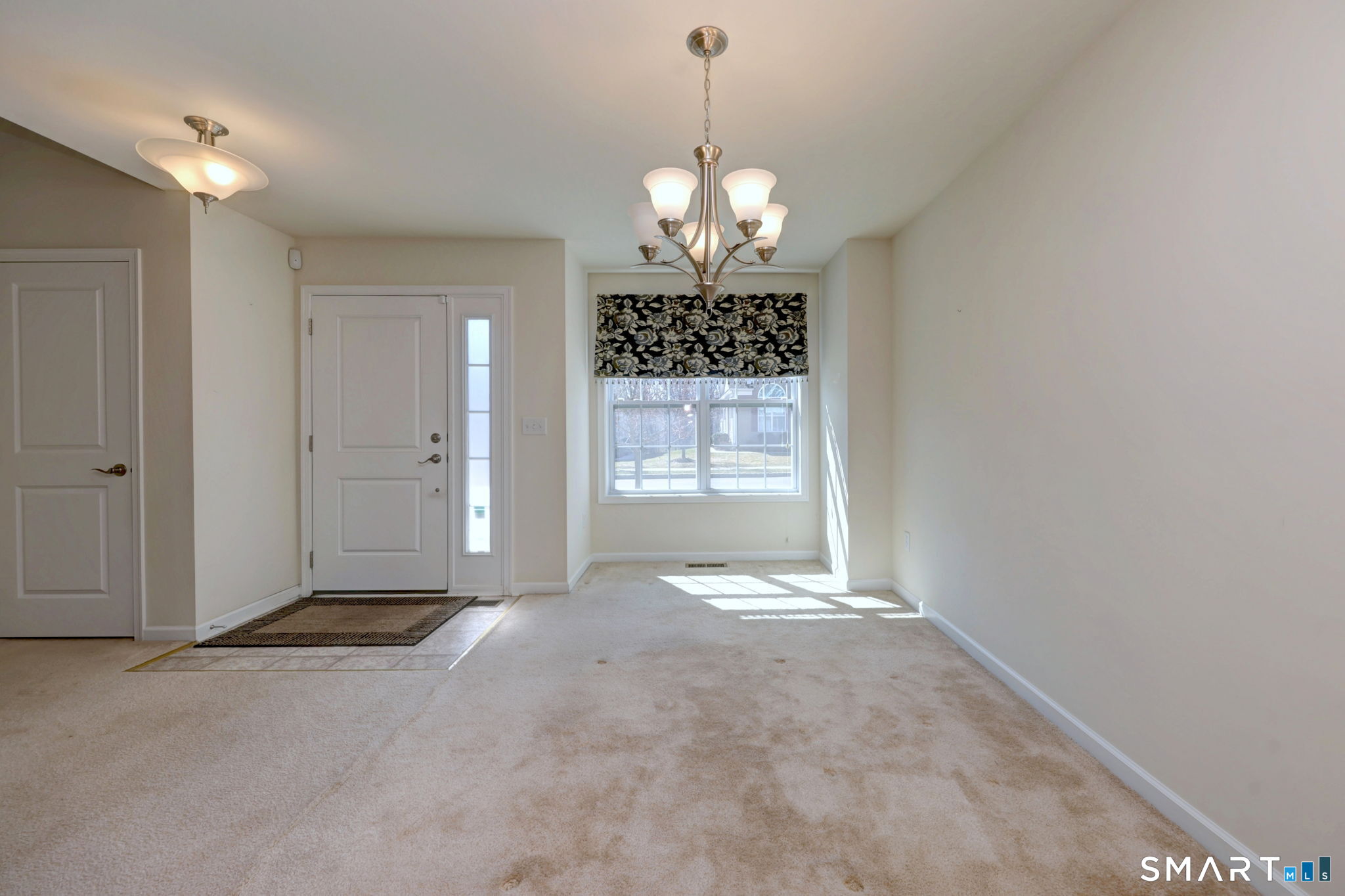 104 Cherry Circle, Unit 104 Prospect, CT 06712 - Photo 10 of 37 a view of a chandelier in big room and chandelier