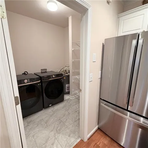 a kitchen with a refrigerator sink and stove