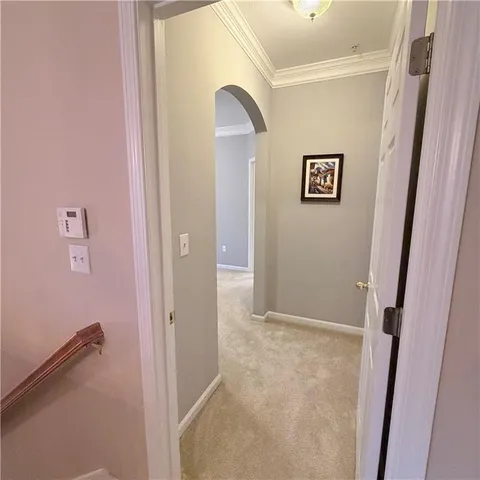 a bedroom with a bed dresser and a window