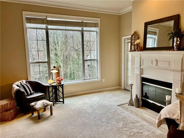 a room with white cabinets and with window