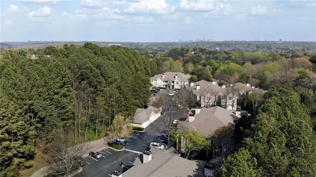 a view of a house with pool table and chairs