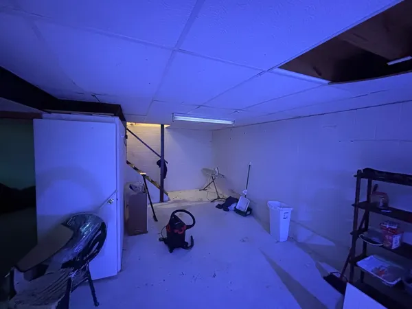 a room with furniture and gym equipment