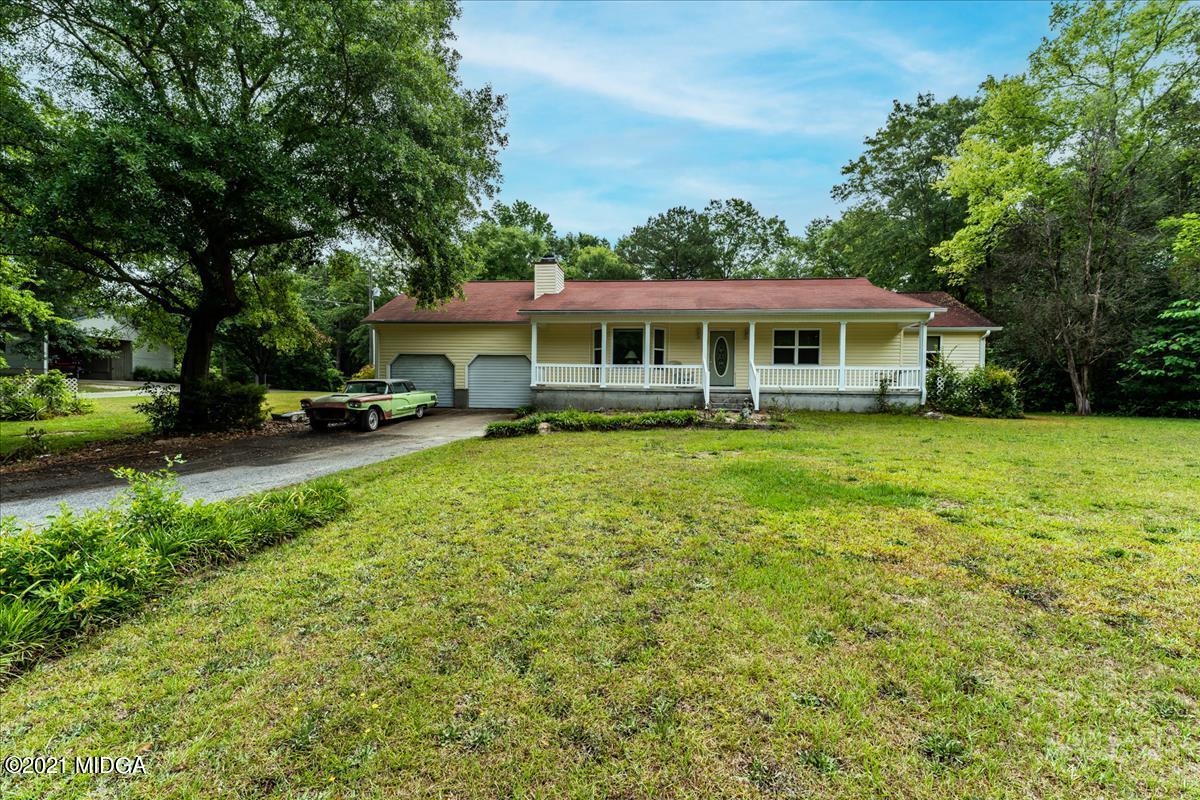 6464 Britt Road Macon, GA 31216 - Photo 1 of 10 a view of a house with a yard porch and sitting area