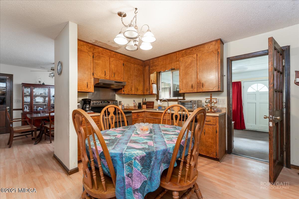 6464 Britt Road Macon, GA 31216 - Photo 7 of 10 a view of a dining room with furniture window and wooden floor
