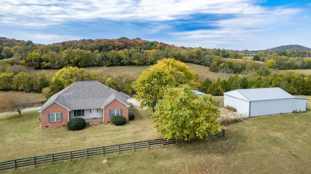 an aerial view of a house with a garden