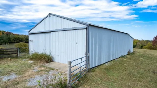a view of a pathway with a wrought fence