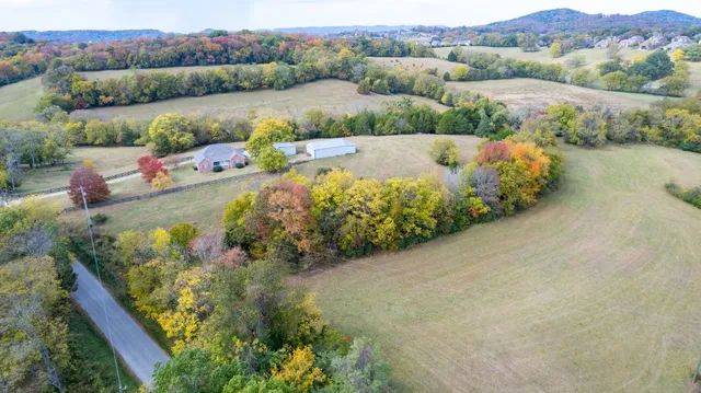 an aerial view of a house with a garden