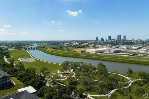 an aerial view of a residential houses with outdoor space and swimming pool