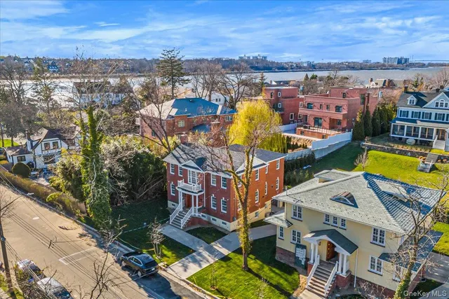 an aerial view of a house with a swimming pool