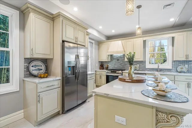 a kitchen with sink cabinets and window