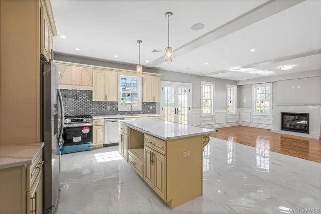 a kitchen with stainless steel appliances granite countertop a stove and a sink