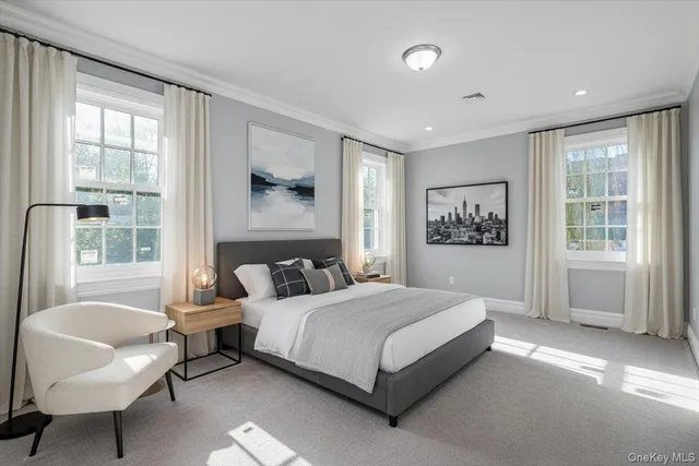 a bedroom with a bed and a couch