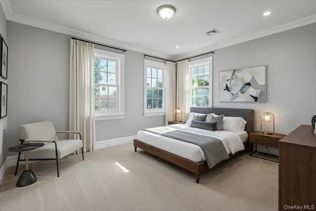 a bedroom with a bed and chair