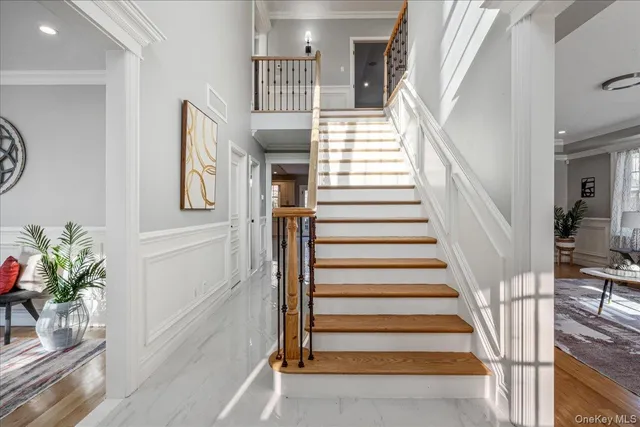 a view of entryway with wooden floor and front door