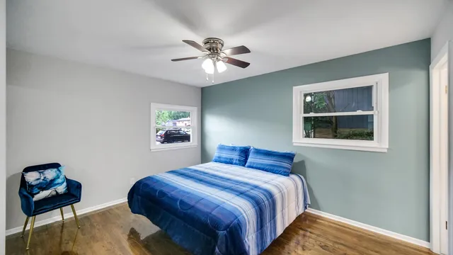 a bedroom with bed and window