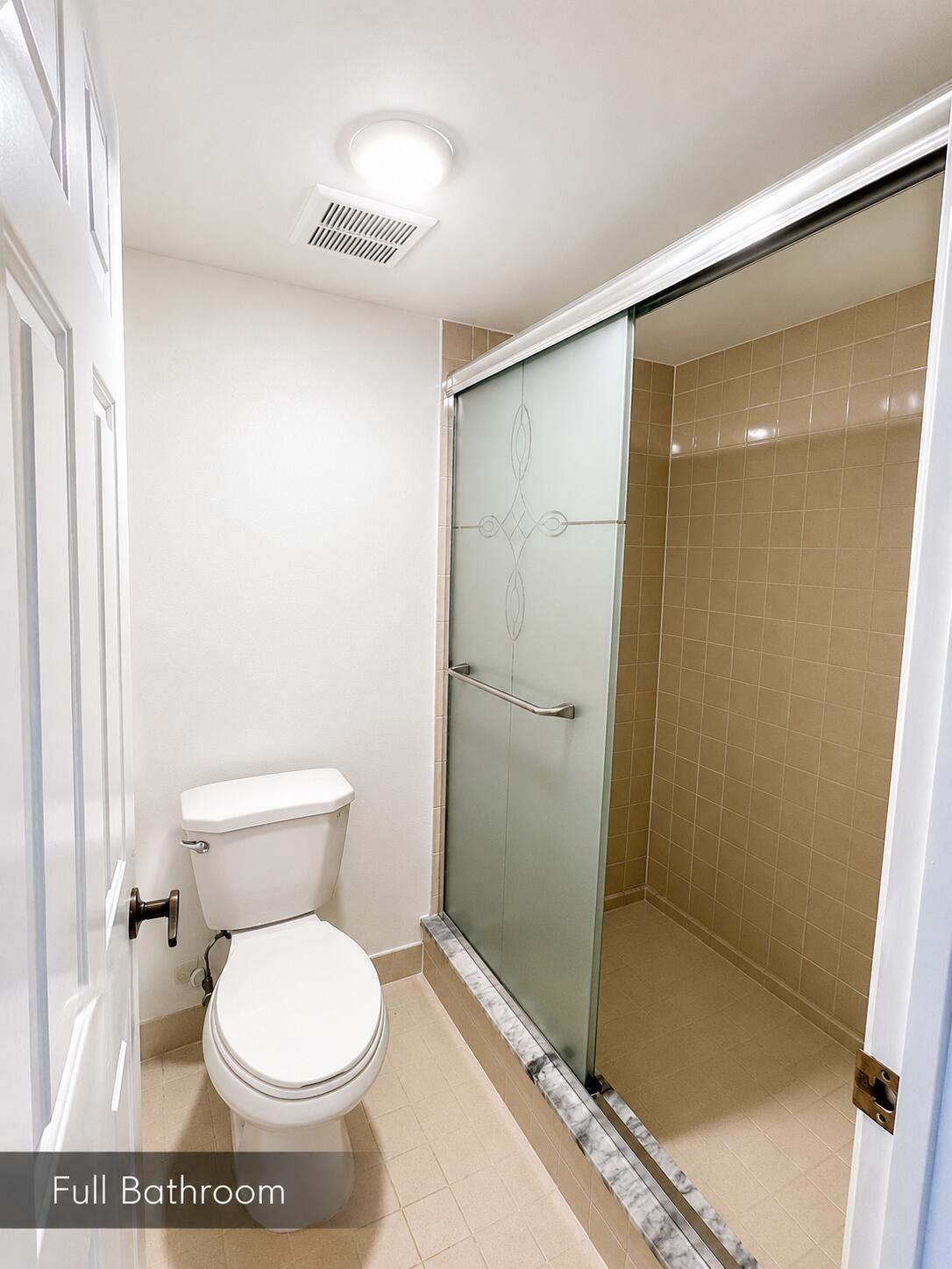 2650 Greenwood Terrace, Unit 2230 Boca Raton, FL 33431 - Photo 11 of 21 a bathroom with a toilet and a shower