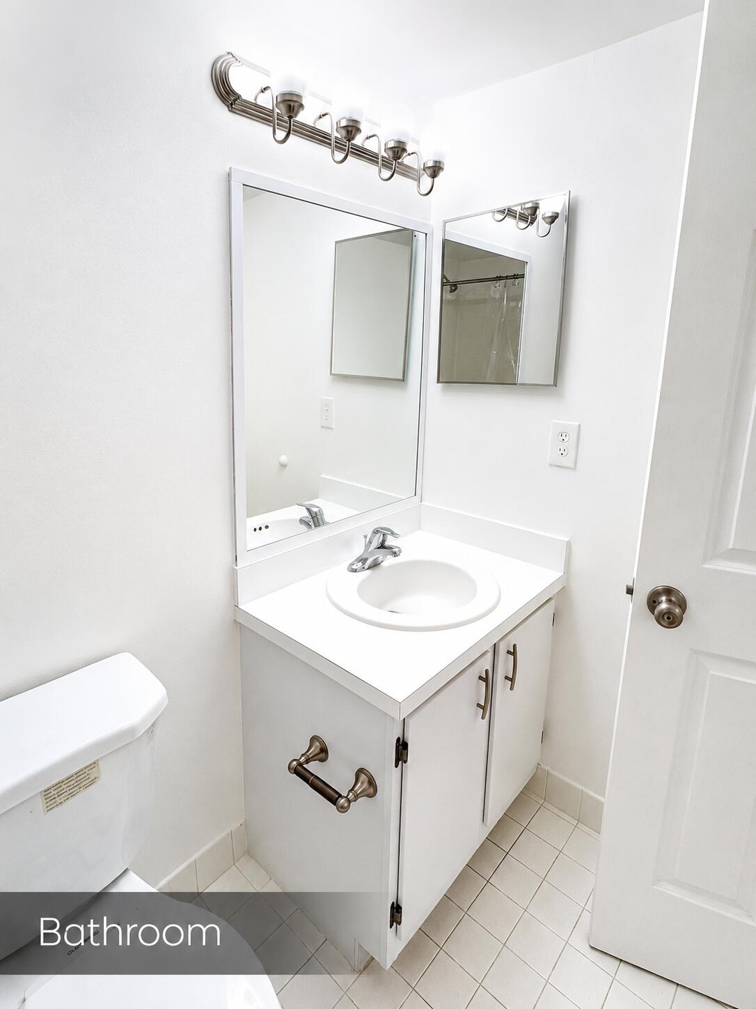 2650 Greenwood Terrace, Unit 2230 Boca Raton, FL 33431 - Photo 12 of 21 a bathroom with a sink and a mirror