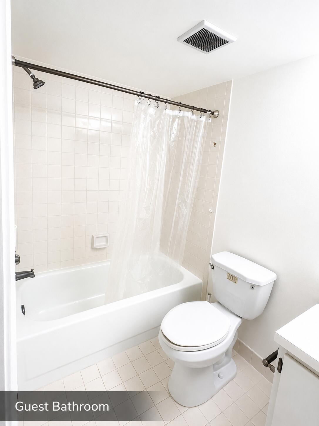 2650 Greenwood Terrace, Unit 2230 Boca Raton, FL 33431 - Photo 15 of 21 a bathroom with a toilet and a bathtub
