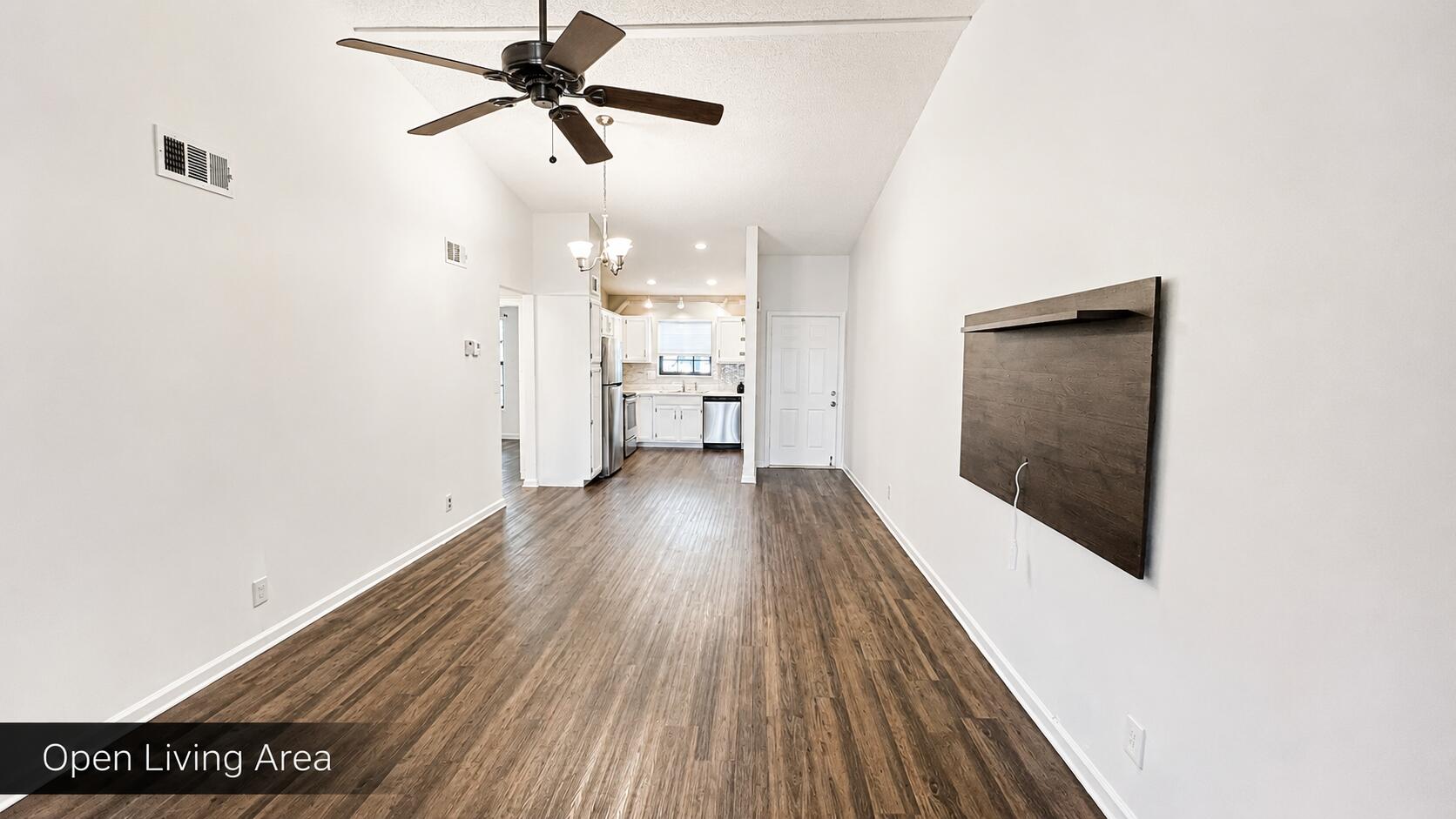 2650 Greenwood Terrace, Unit 2230 Boca Raton, FL 33431 - Photo 3 of 21 a view of a hallway with wooden floor and a chandelier fan