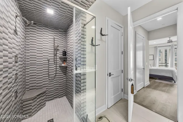 a spacious bathroom with a sink a mirror and a bathtub