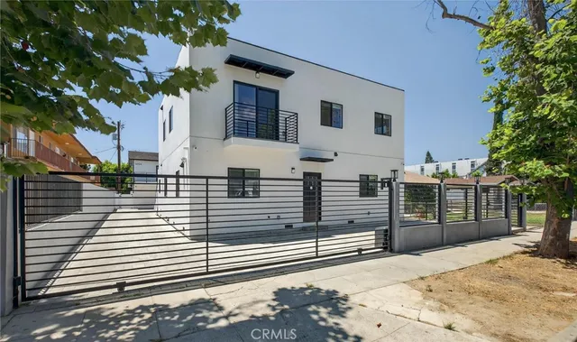 a view of a brick house with a large window