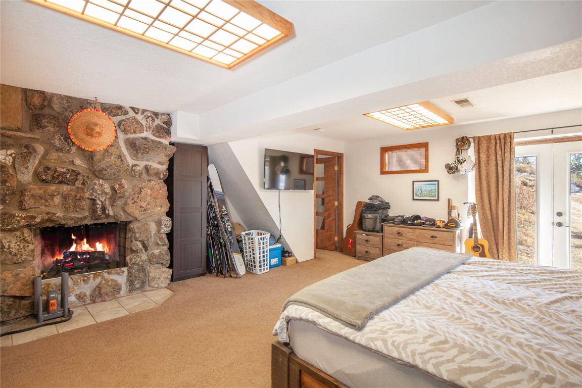 97 Rd G Silverthorne, CO 80498 - Photo 15 of 26 a bed room with a bed and a fireplace