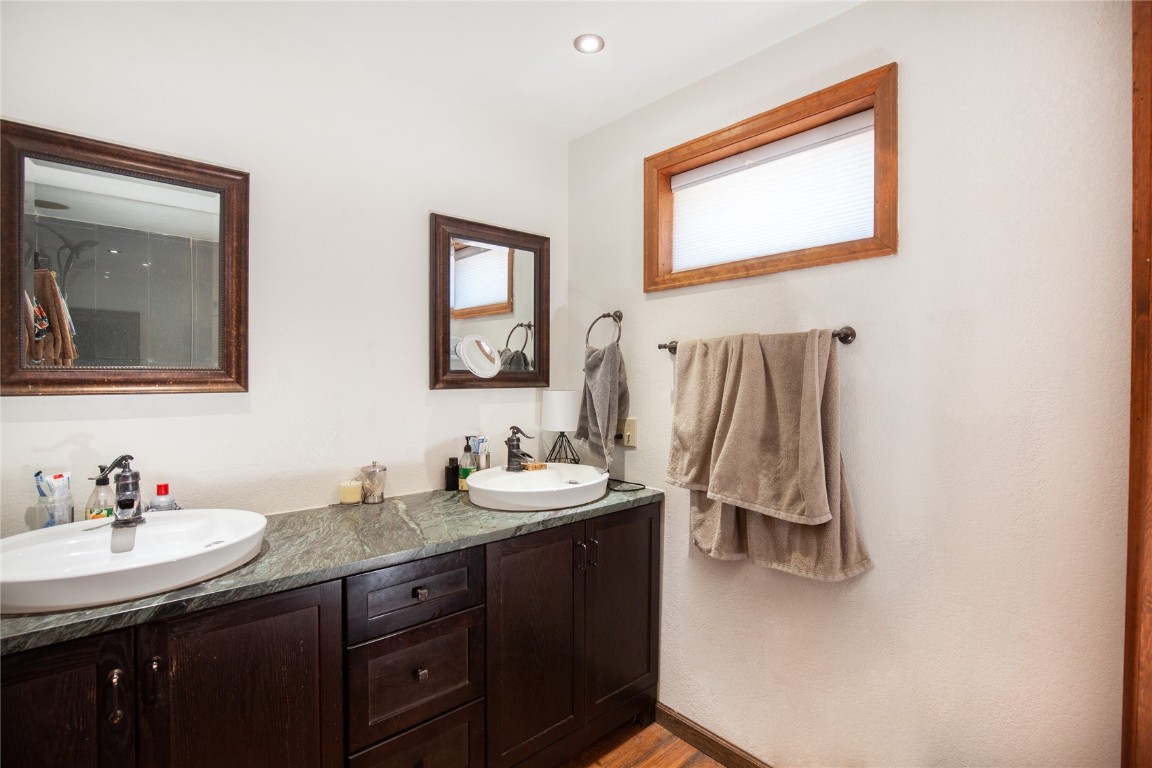 97 Rd G Silverthorne, CO 80498 - Photo 17 of 26 a bathroom with a sink vanity and a mirror