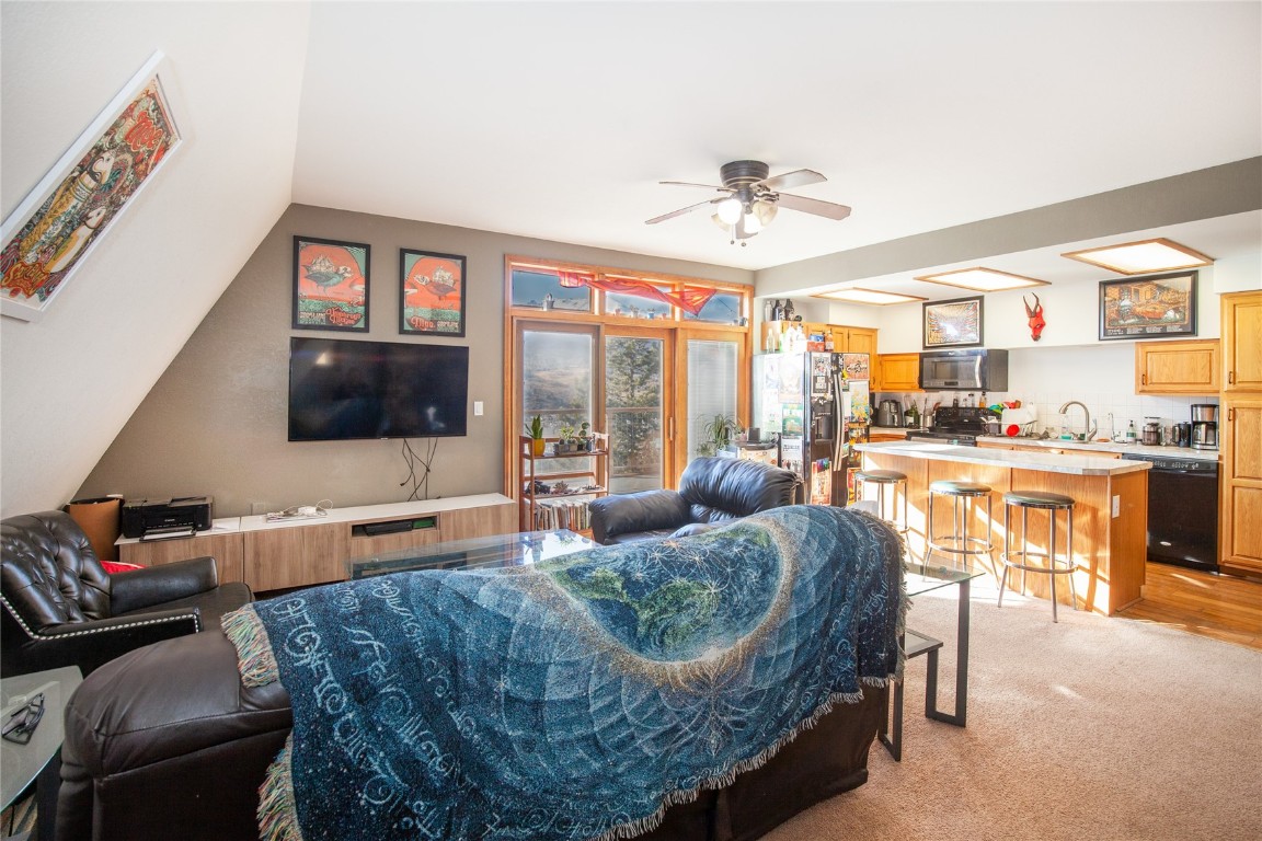 97 Rd G Silverthorne, CO 80498 - Photo 9 of 26 a living room with furniture and a flat screen tv