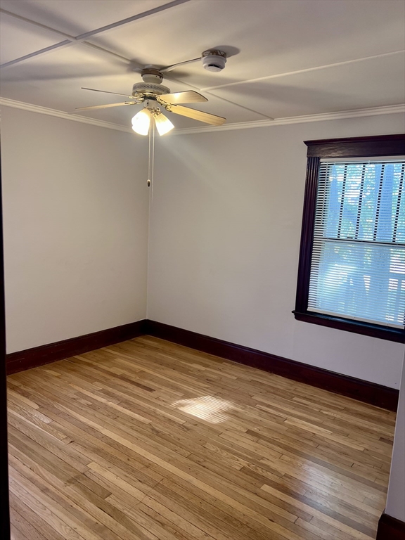 264 Boston Street, Unit 3 Lynn, MA 01904 - Photo 5 of 6 a view of empty room with window and wooden floor