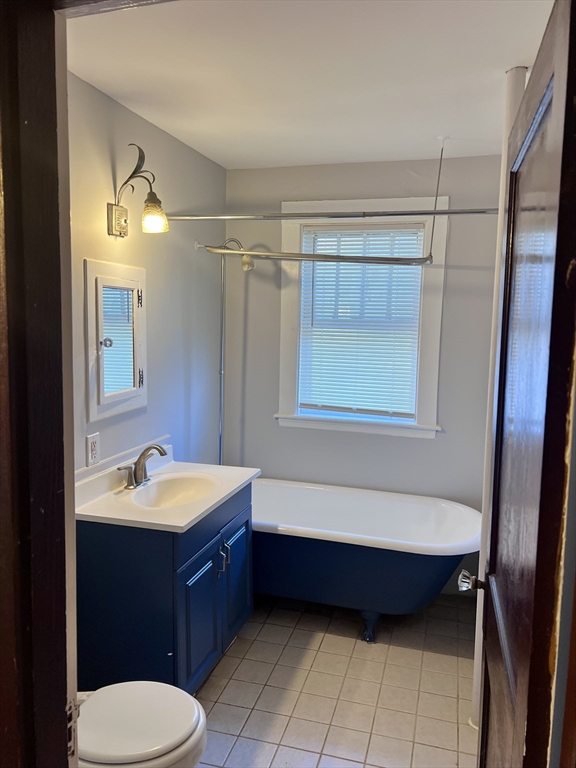 264 Boston Street, Unit 3 Lynn, MA 01904 - Photo 6 of 6 a bathroom with a sink a toilet and bathtub