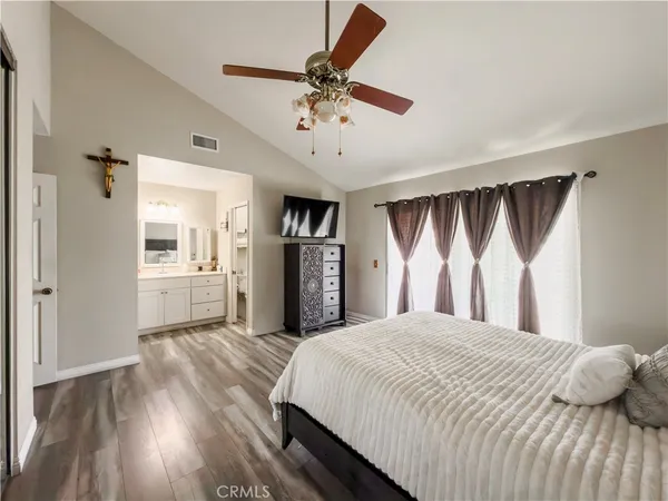 a room with a walk in closet and a mirror