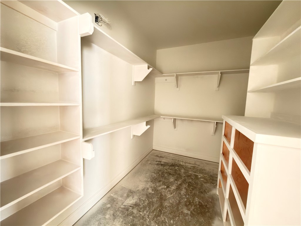 2602 Milo Street Corpus Christi, TX 78415 - Photo 11 of 14 a view of walk in closet with empty racks
